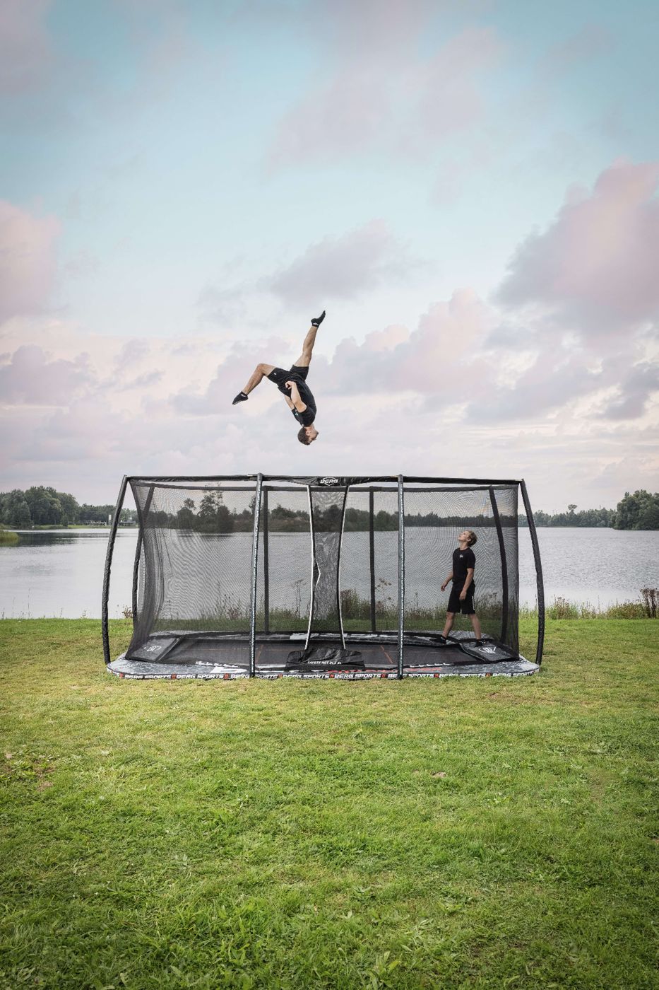 BERG FlatGround Pro Bouncer trampoline with a safety net, set level with a garden lawn